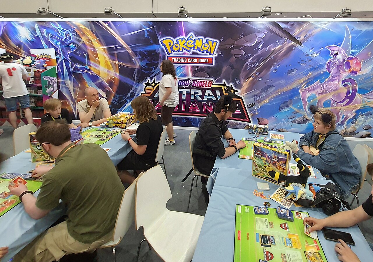 Pokémon Trading Card Game setup at Pyrkon 2022 convention with cards and playmat