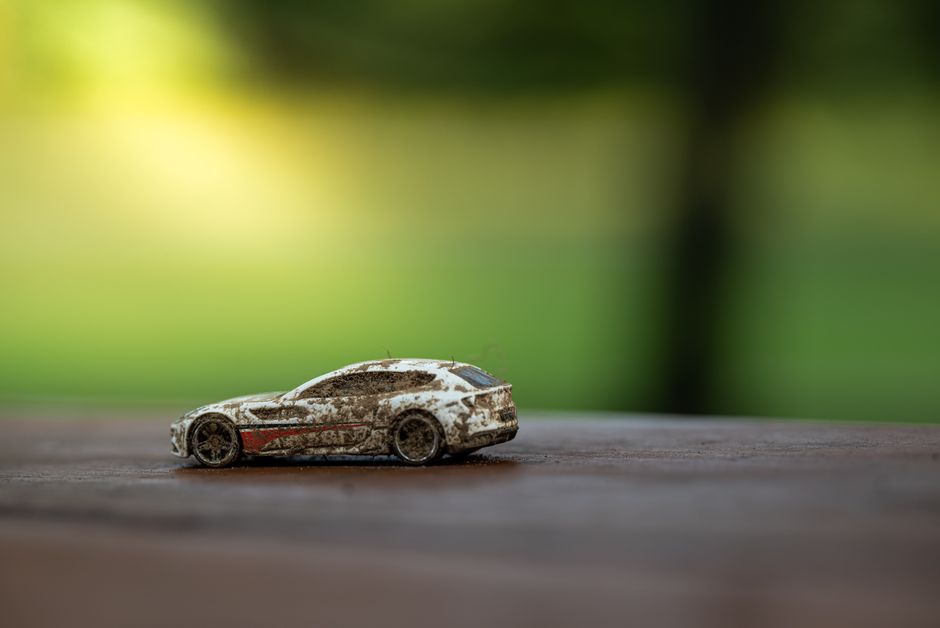 Close-up of collectible toy car on wooden surface