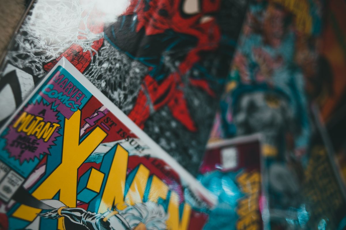 Comic Book Collecting Guide for Beginners 4 Collection of various comic books with colorful covers spread on surface