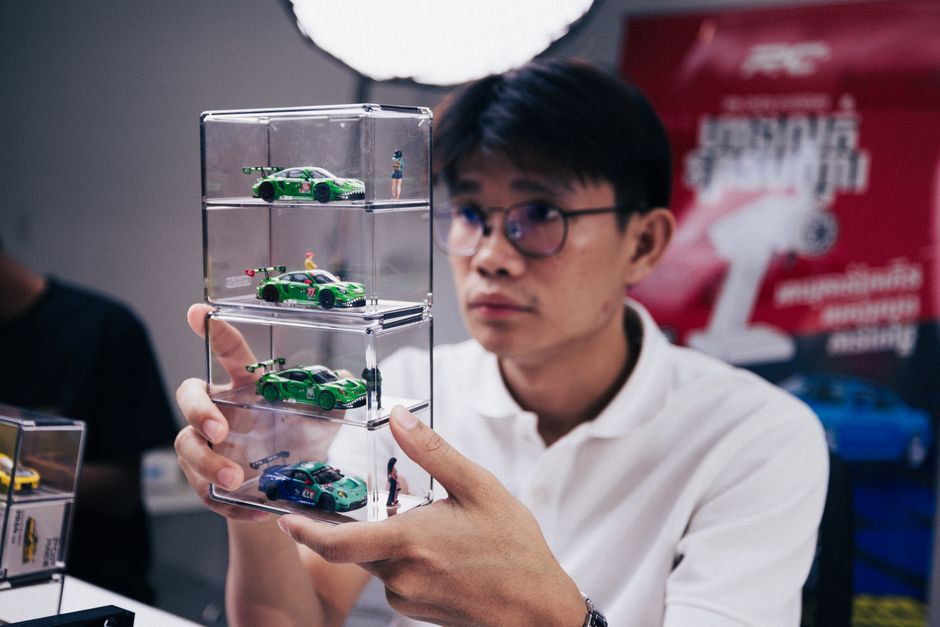 Scale model collectibles in a stackable display case