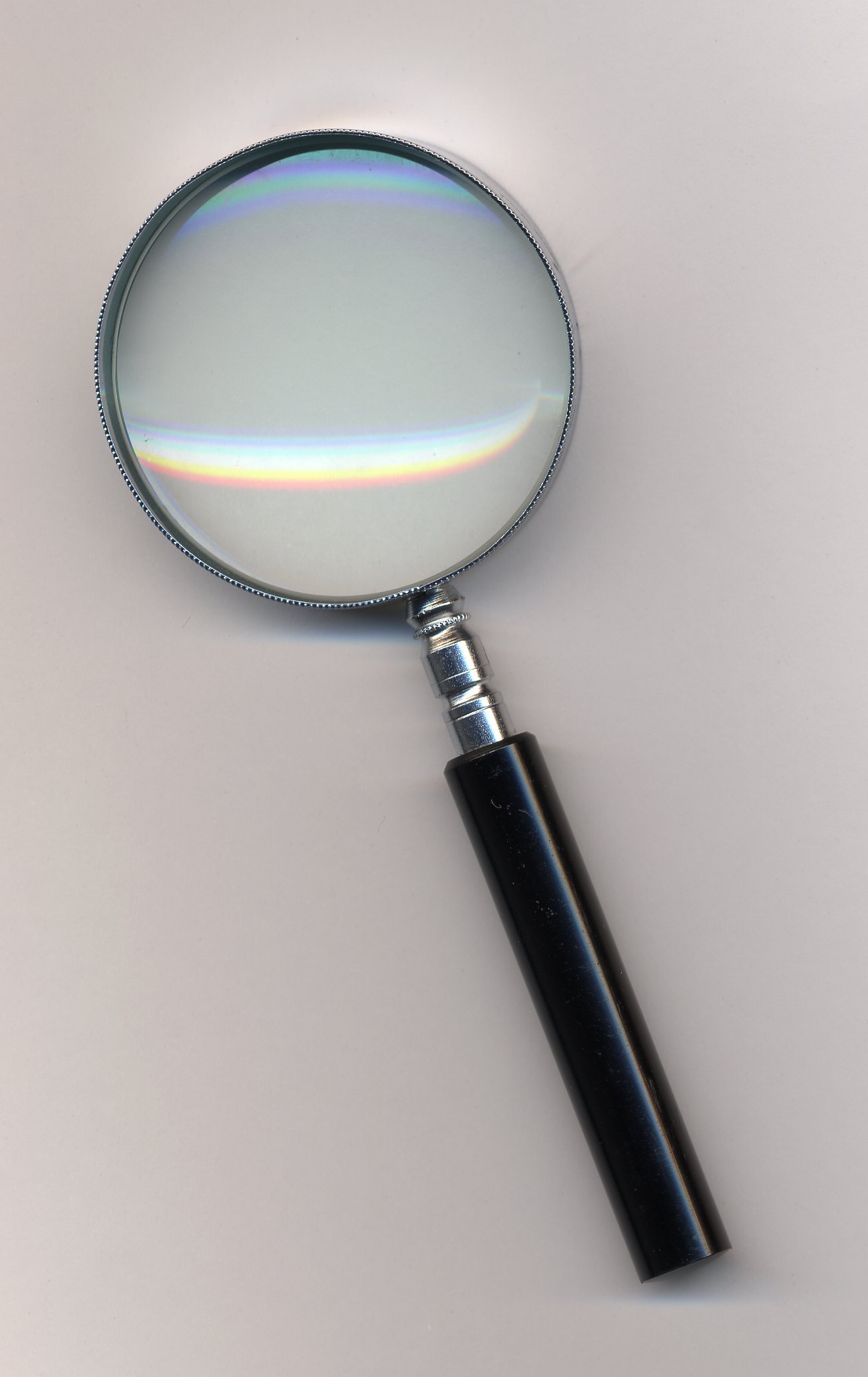 A standard magnifying glass for coin inspection