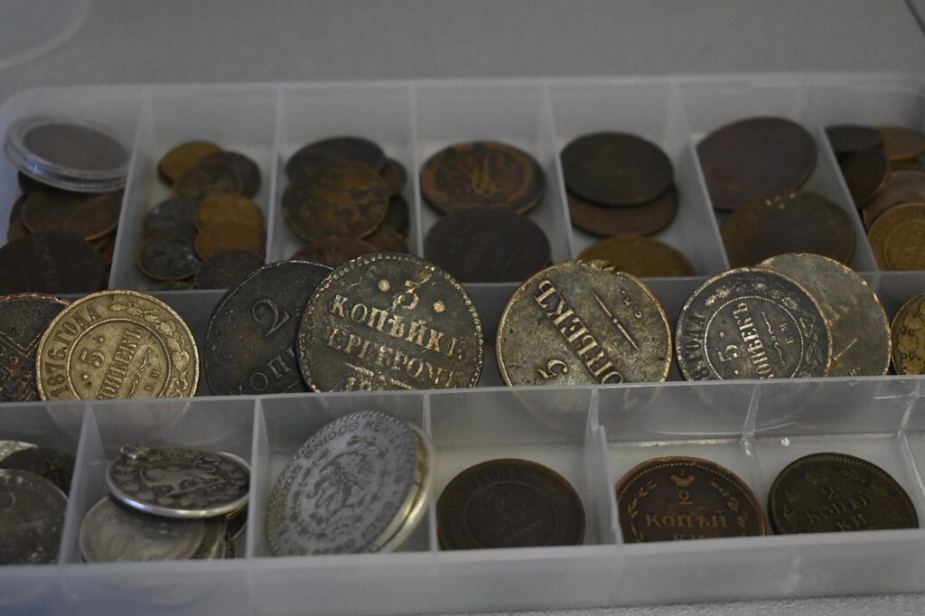 Close-up of circulated coins showing wear levels
