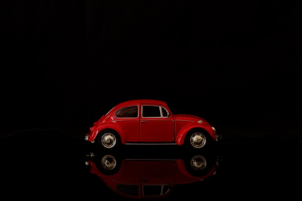 How to Grade Die-Cast Cars Yourself Before Sending to a Professional 2 Close-up of magnifying loupe examining die-cast car paint details