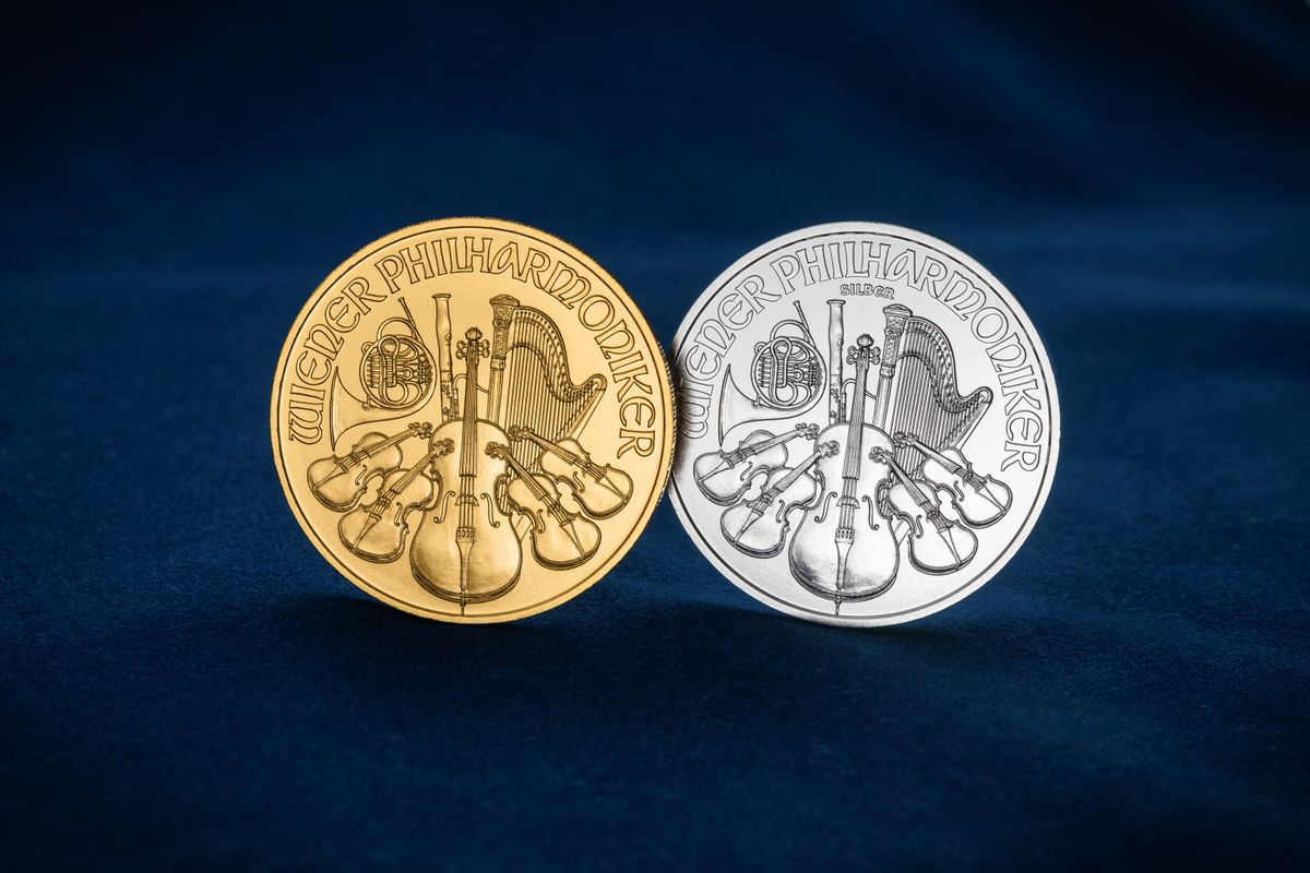 Coin Storage Mistakes That Cost You Grade Points — and How to Fix Them 3 Gold and silver Wiener Philharmoniker coins on blue velvet, showing the fine details graders evaluate