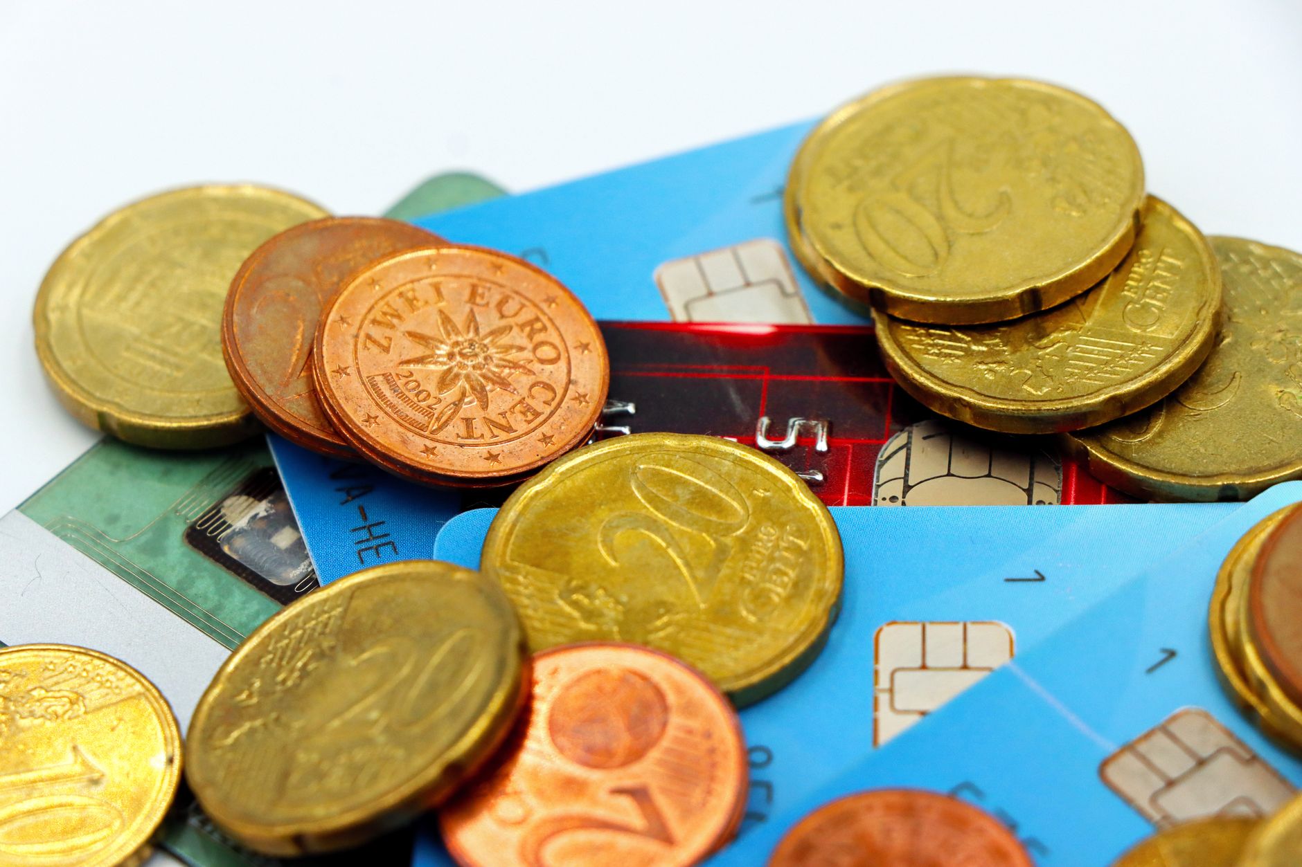 euro coins and payment cards close-up photo