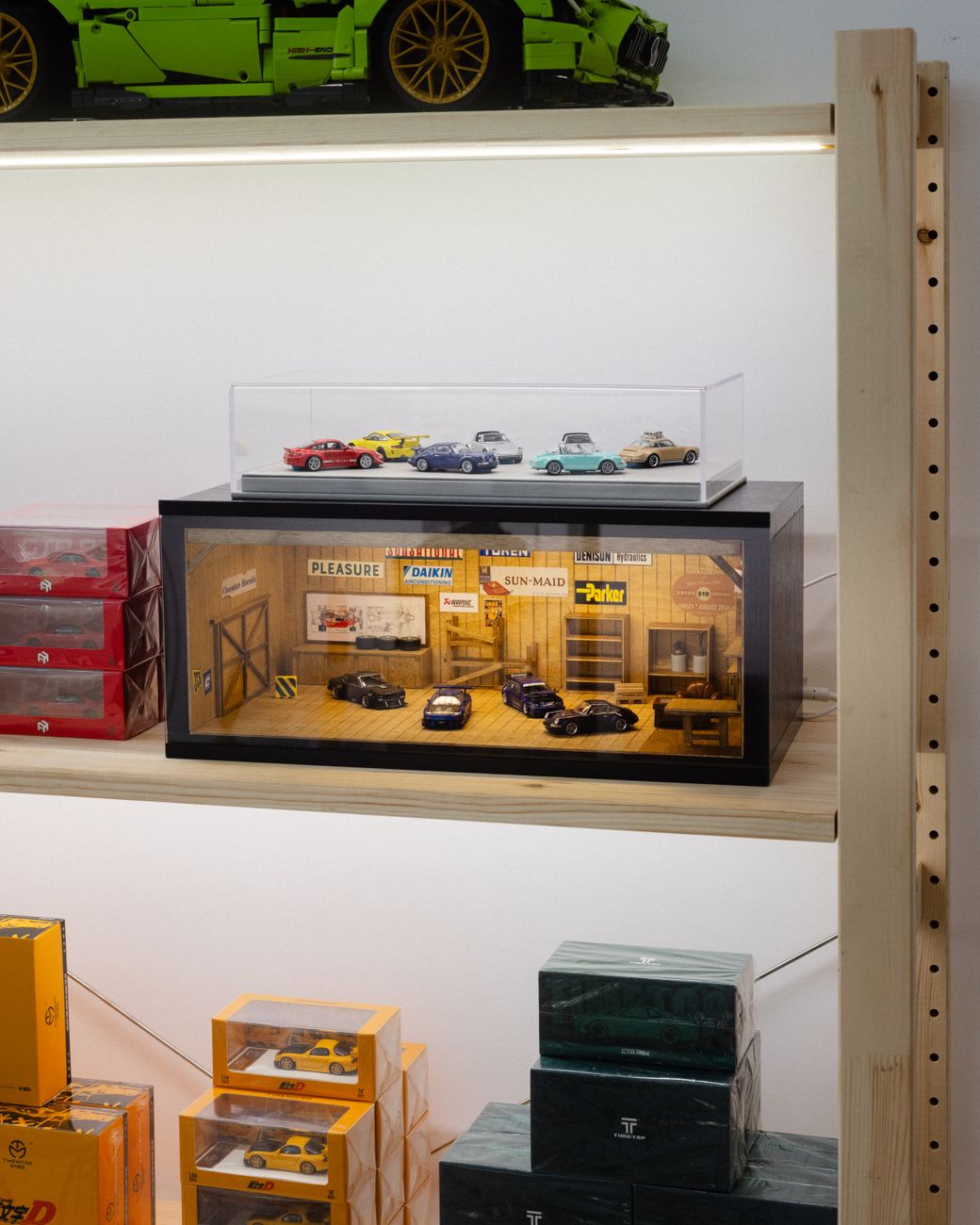 How to Compare Diecast Scales Before Starting a Display-Focused Collection 2 Diecast model cars in a display case