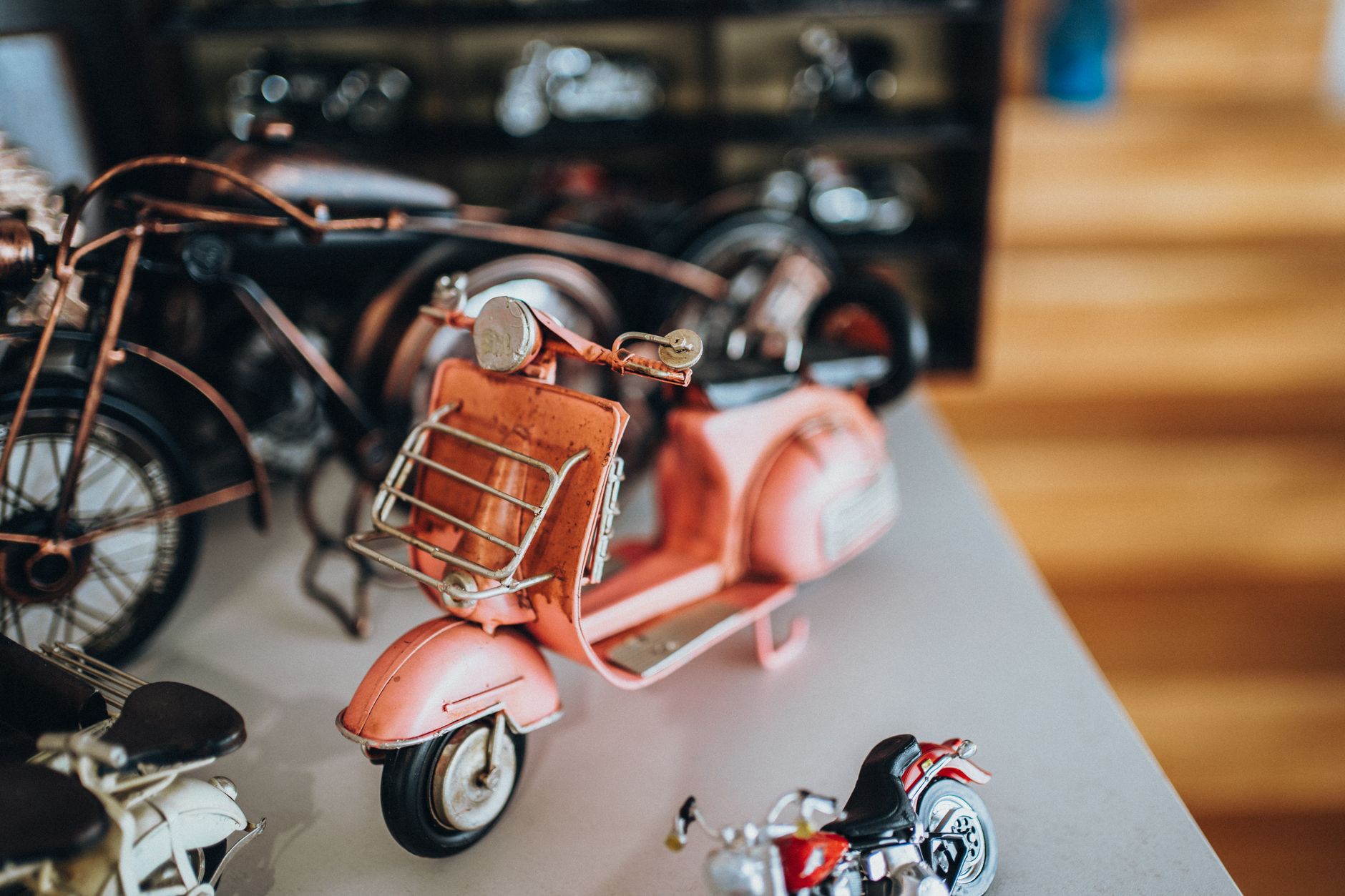 Diecast model cars arranged on a display shelf