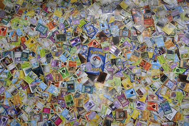 Pokemon and Yu-Gi-Oh trading card collection photo