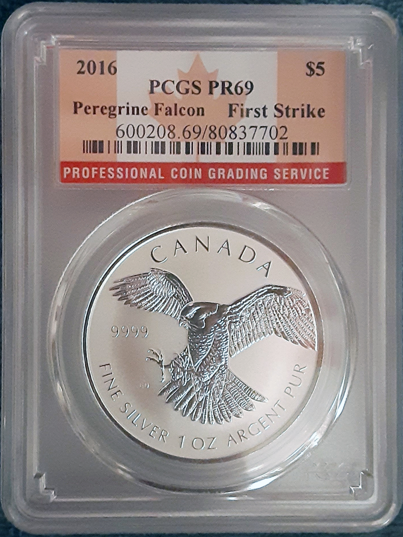 How to Separate Bullion Coins from Collectible Coins Before Researching Value 3 A Canadian Peregrine Falcon silver coin in a PCGS graded slab holder labeled PR69
