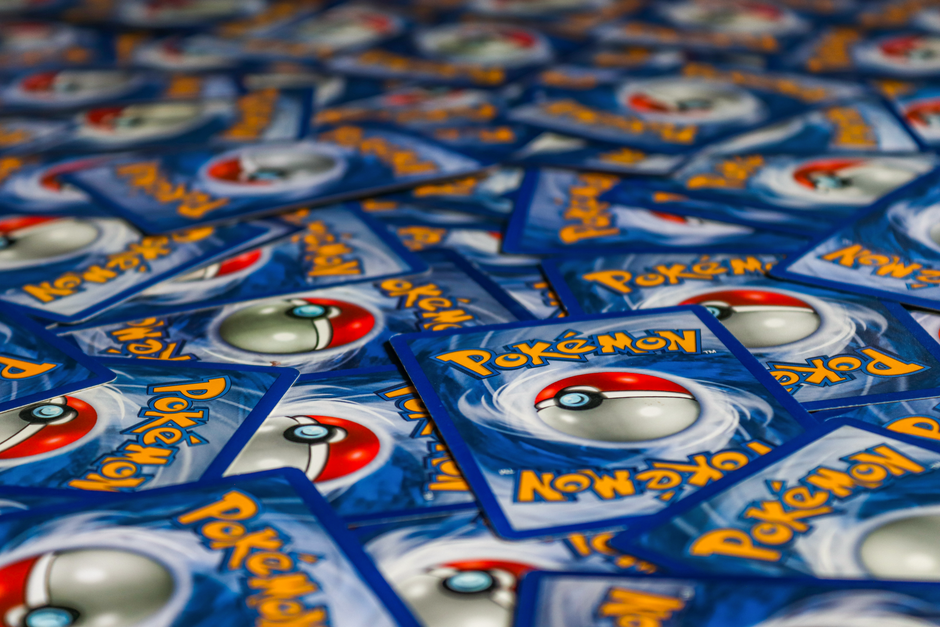 How to Build a Pokémon Card Binder Around One Set Without Buying Duplicates 1 A vibrant display of Pokémon trading cards featuring the iconic Pokeball design