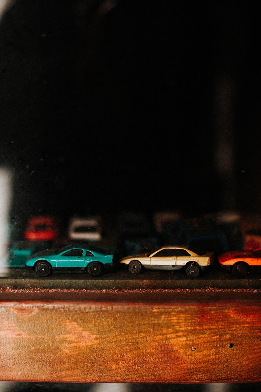 Toy cars on a wooden surface display