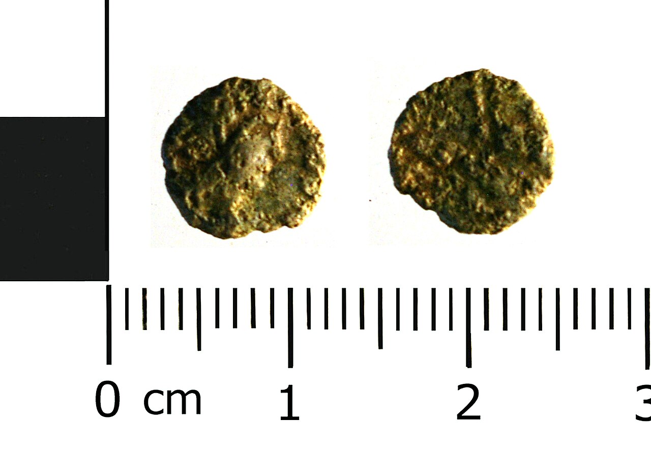 Roman coin obverse and reverse under inspection