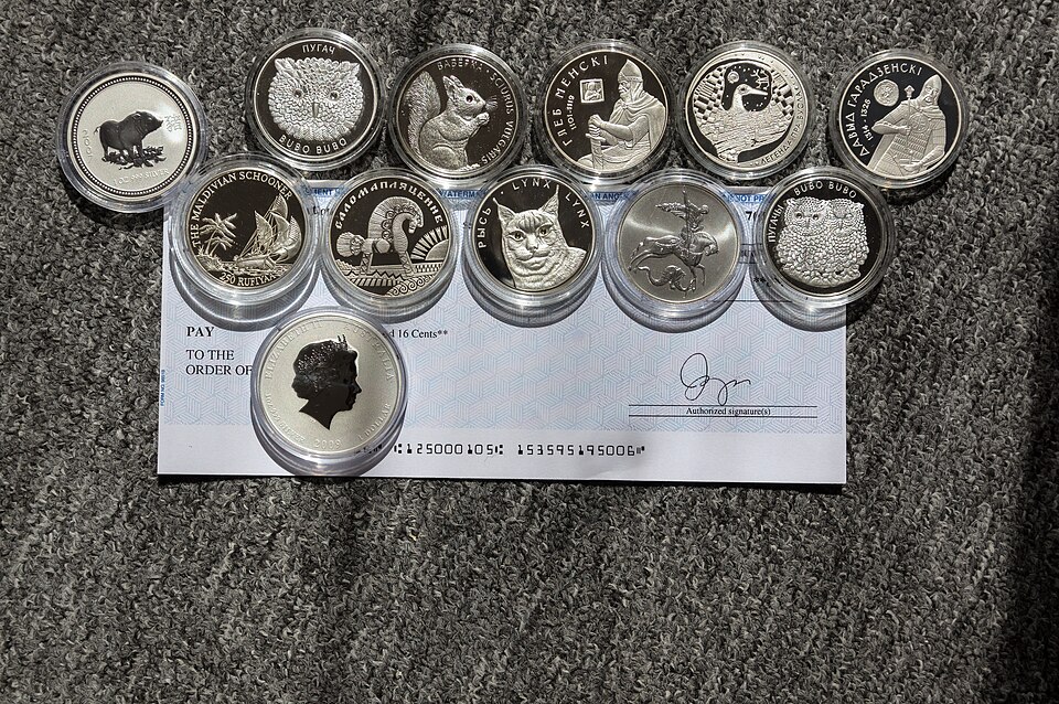 How to Evaluate Coin Collection Starter Kits Before Buying One 3 silver coins arranged for collection review